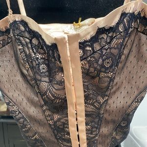 Champagne and black corset with adjustable spaghetti straps. Made by Marciano